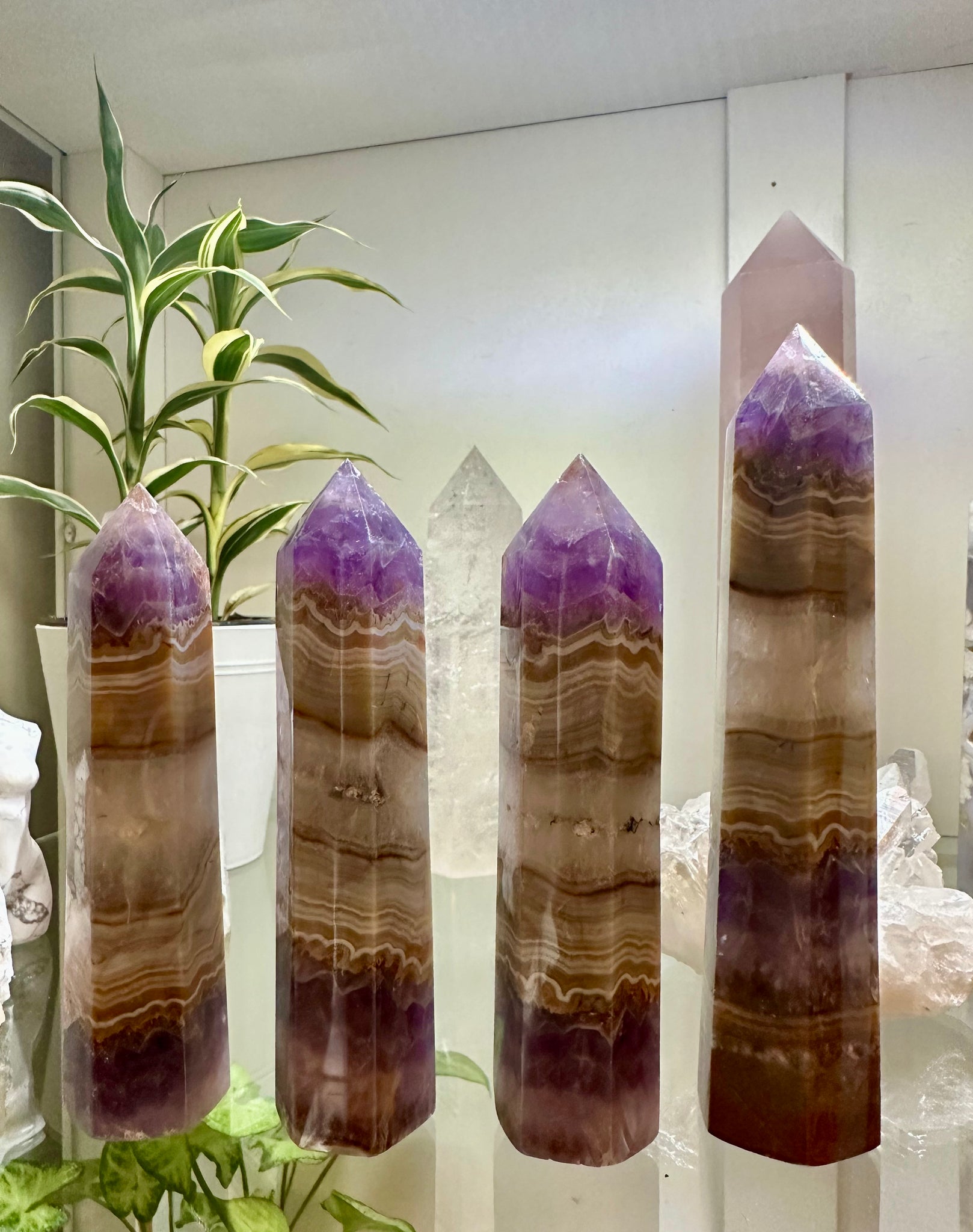 Kelowna Crystal Cave - A three-tiered amethyst agate garden stone with a polished surface, displayed in a home setting.