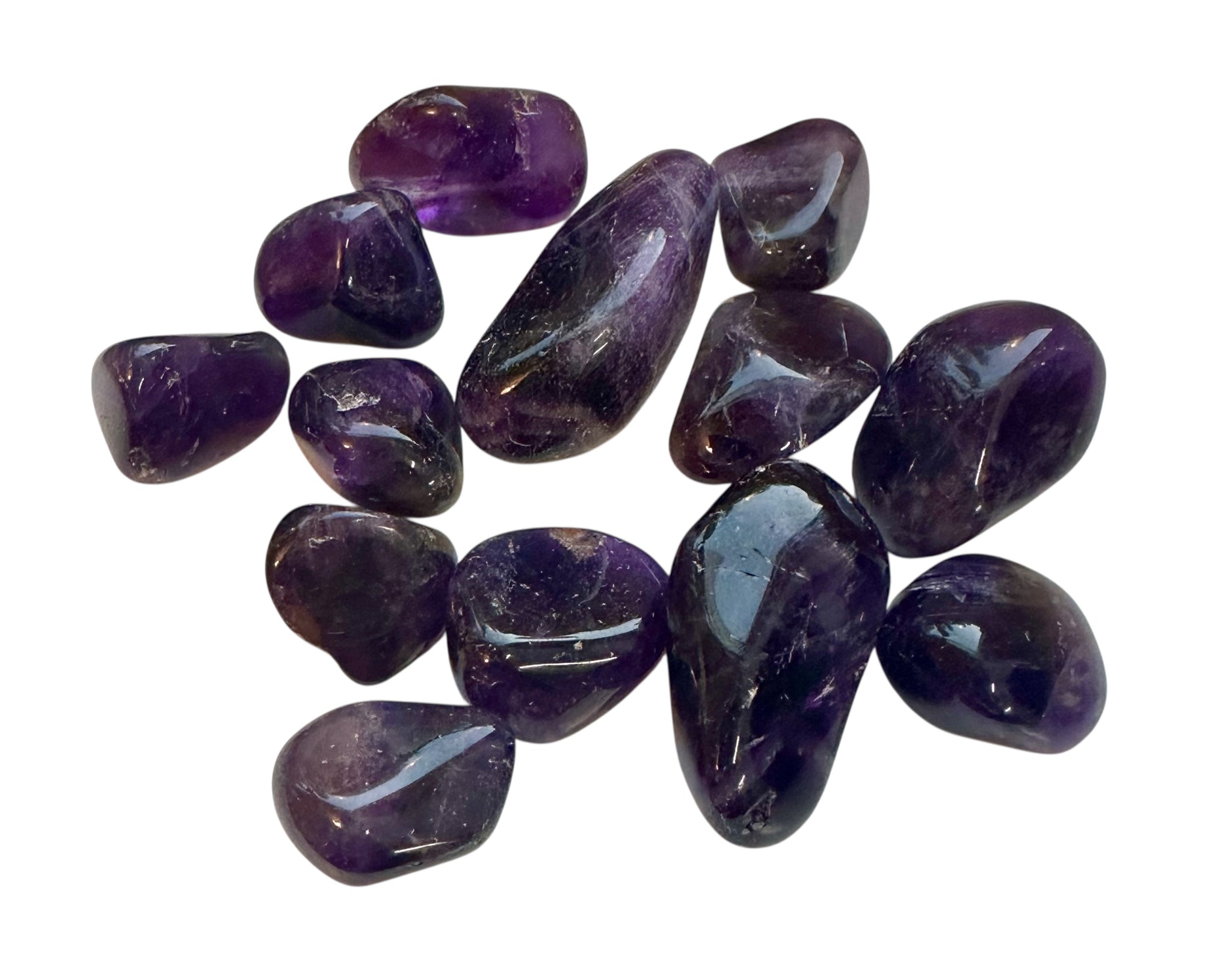 Kelowna Crystal Cave - Amethyst stones on a white background