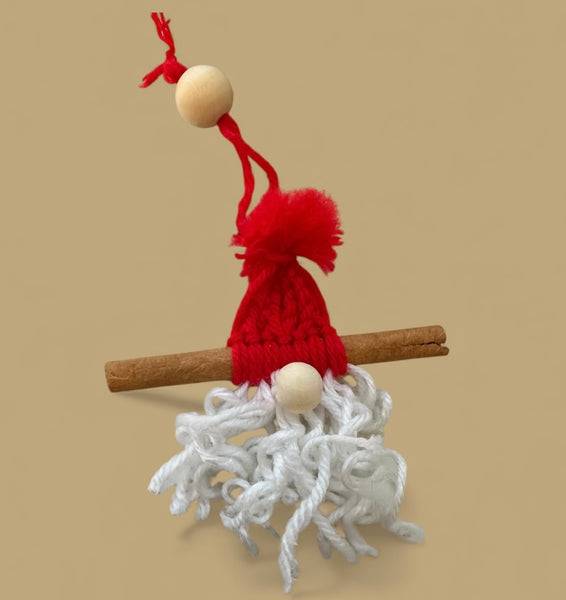 Blazin Creationz - Small gnome figurine with a red hat and white beard on a beige background