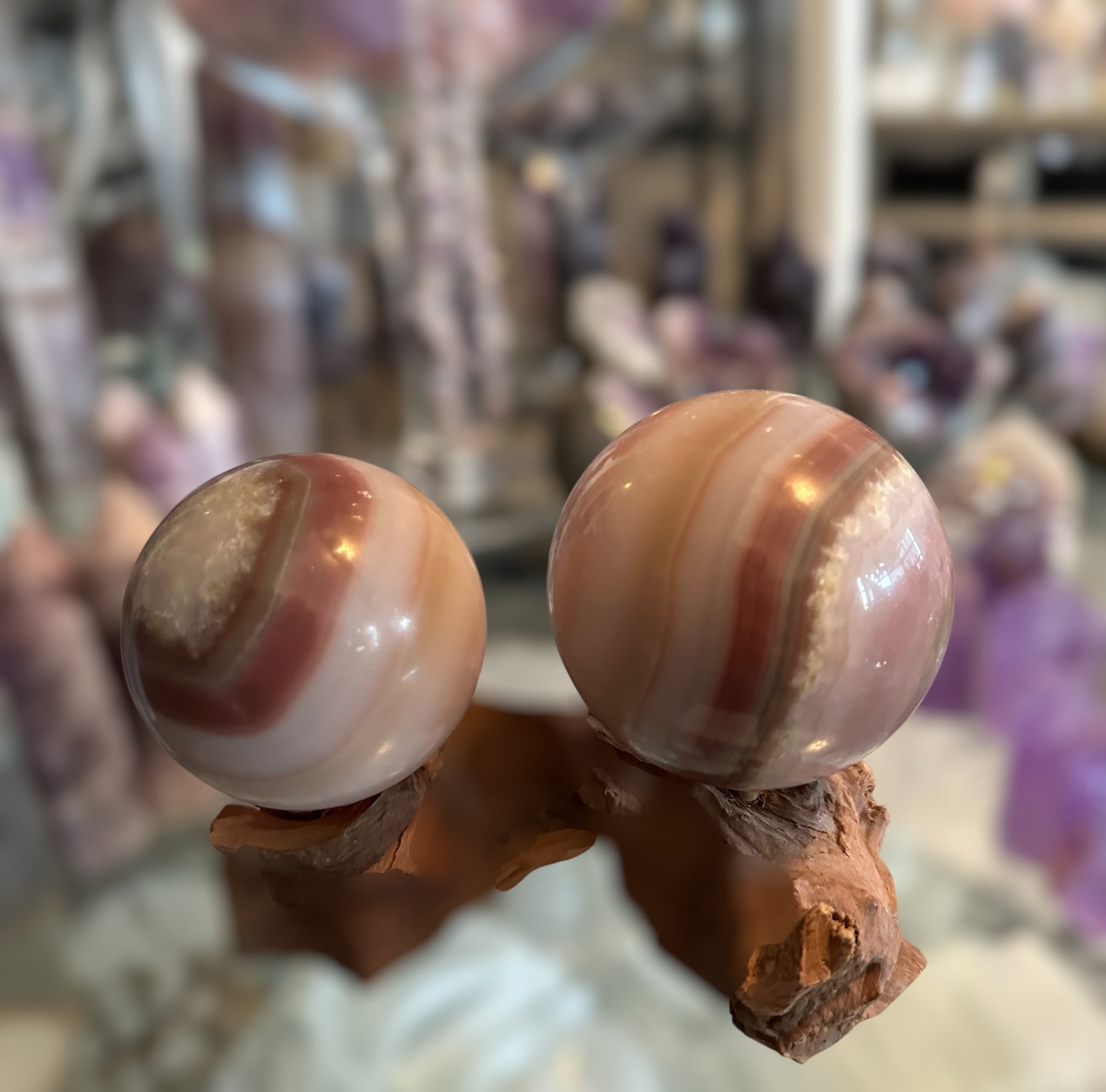 Kelowna Crystal Cave - Pink Banded Onyx Sphere on wooden stand