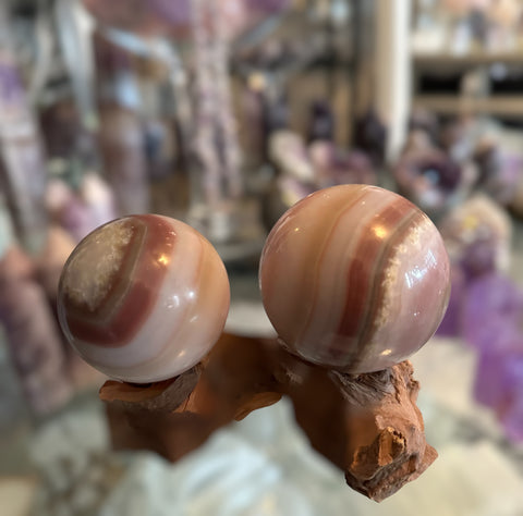 Kelowna Crystal Cave - Pink Banded Onyx Sphere on wooden stand