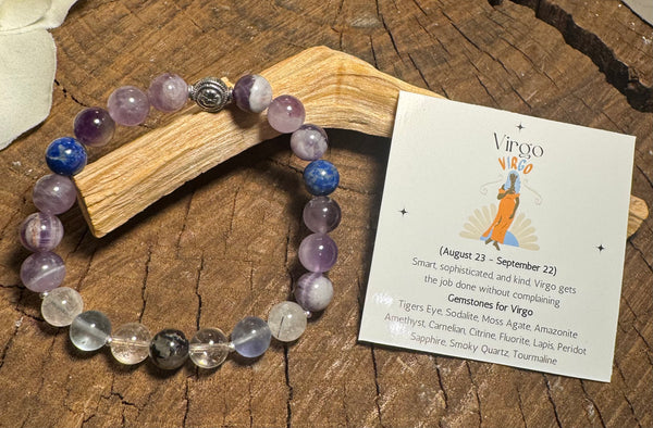 My Two Daughters Jewelry - Crystal bracelet with a Virgo card on a wooden surface