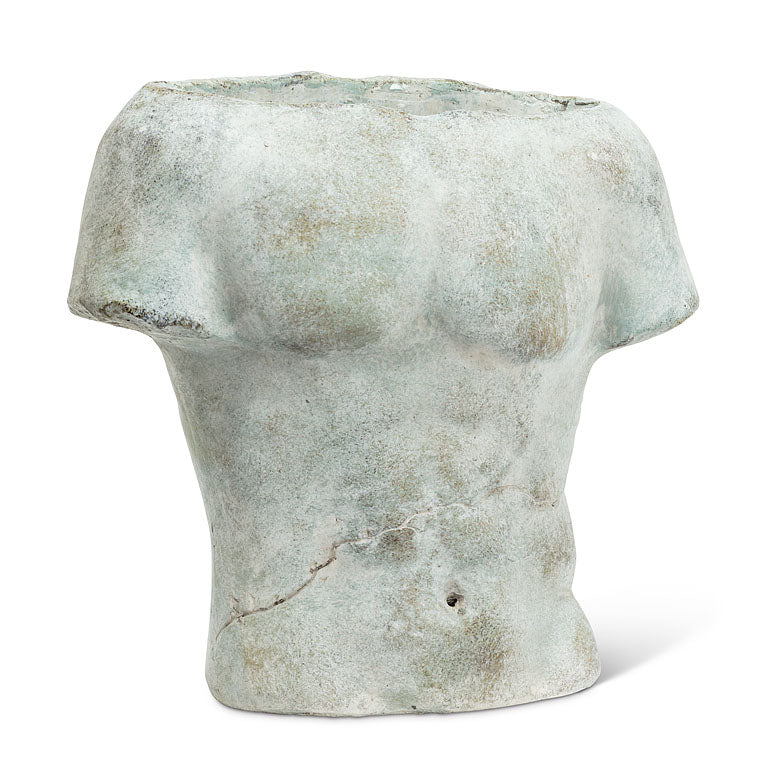 A concrete planter in the shape of a male torso with a rough, textured surface in various shades of gray and white.